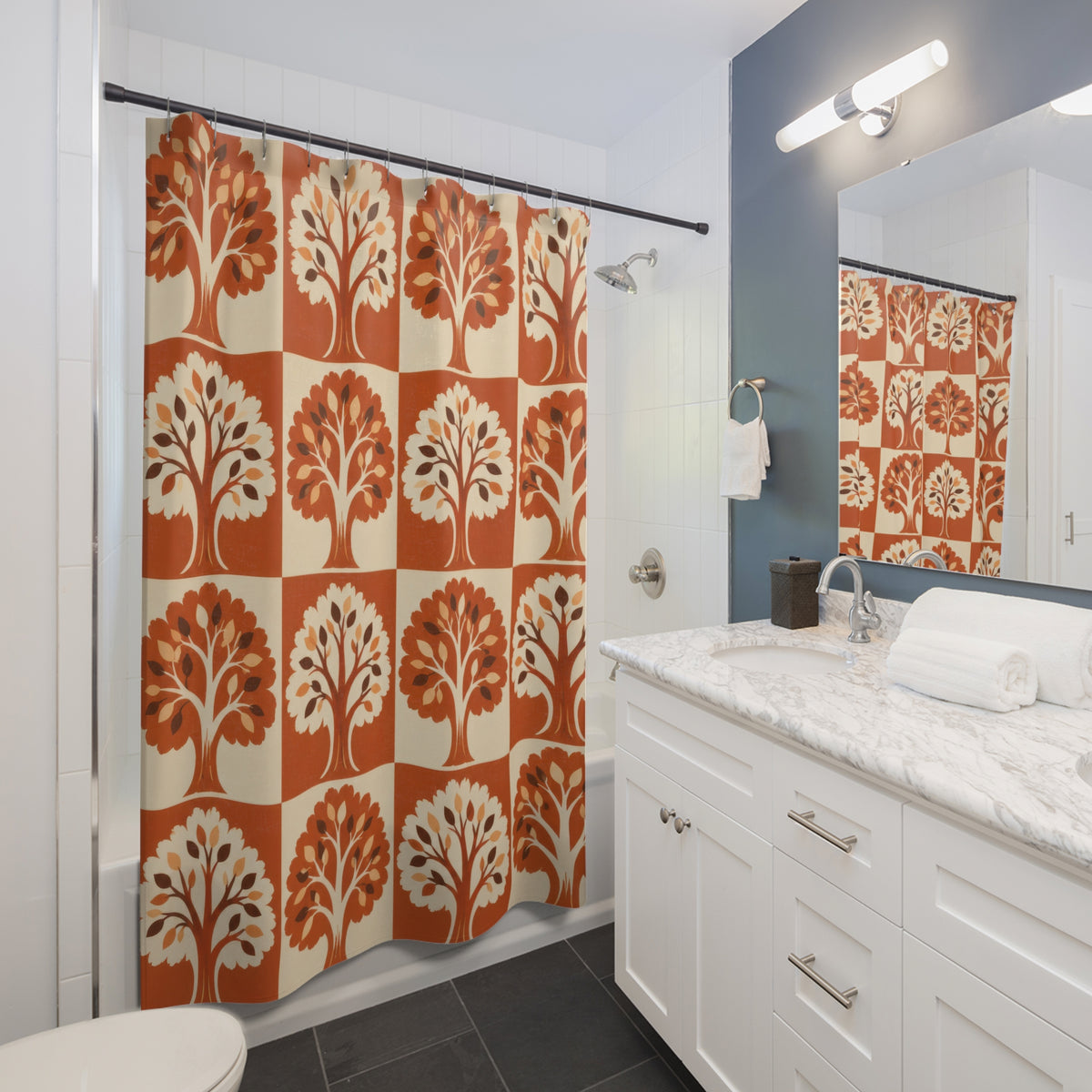 Orange and cream tree checkerboard shower curtain beside a white vanity