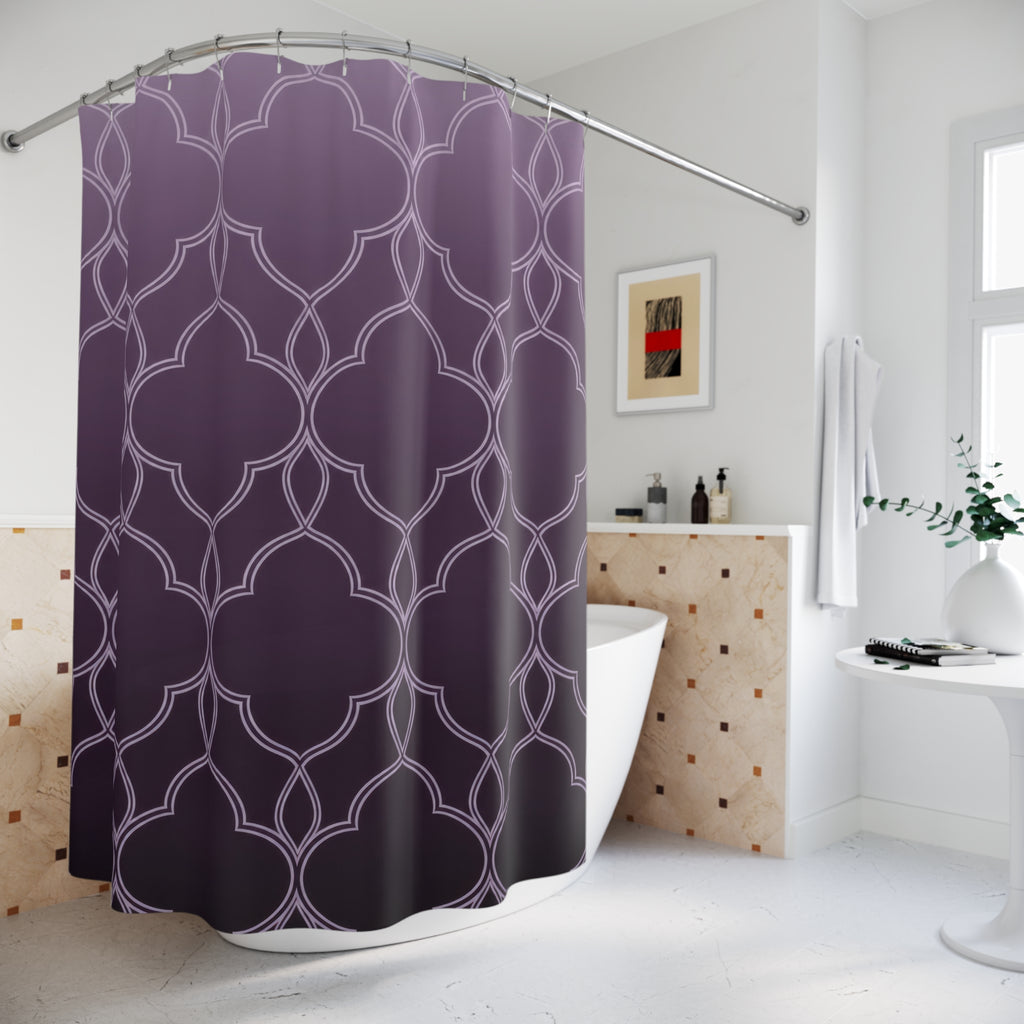Pale quatrefoil tracery over a lavender to plum ombre shower curtain beside a freestanding tub