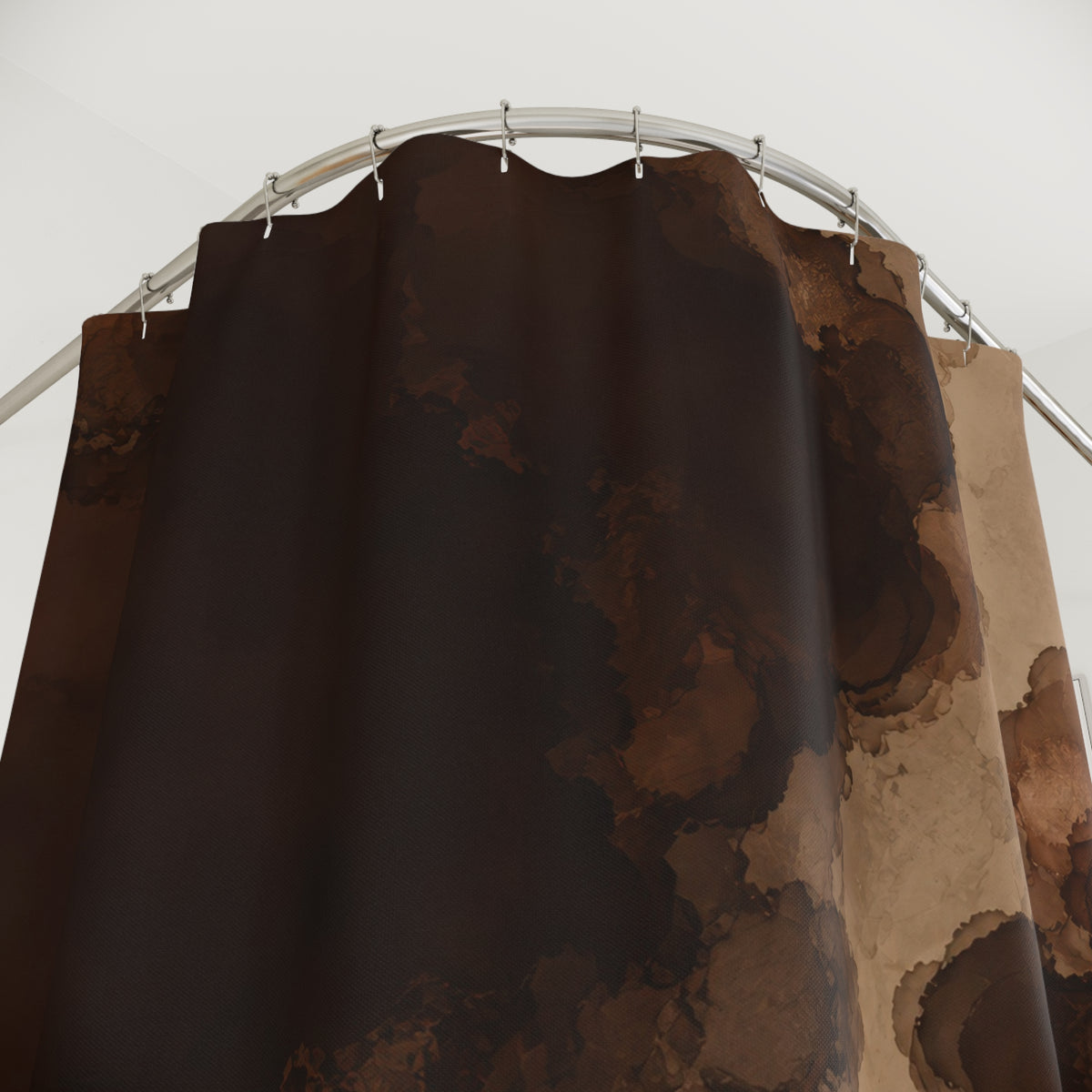 Dark brown ink blooms with a winding tan opening shower curtain with close-up print, hooks, and folds