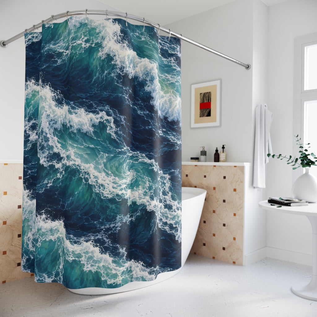 Turquoise breaking waves and white sea foam on navy water shower curtain beside a freestanding tub