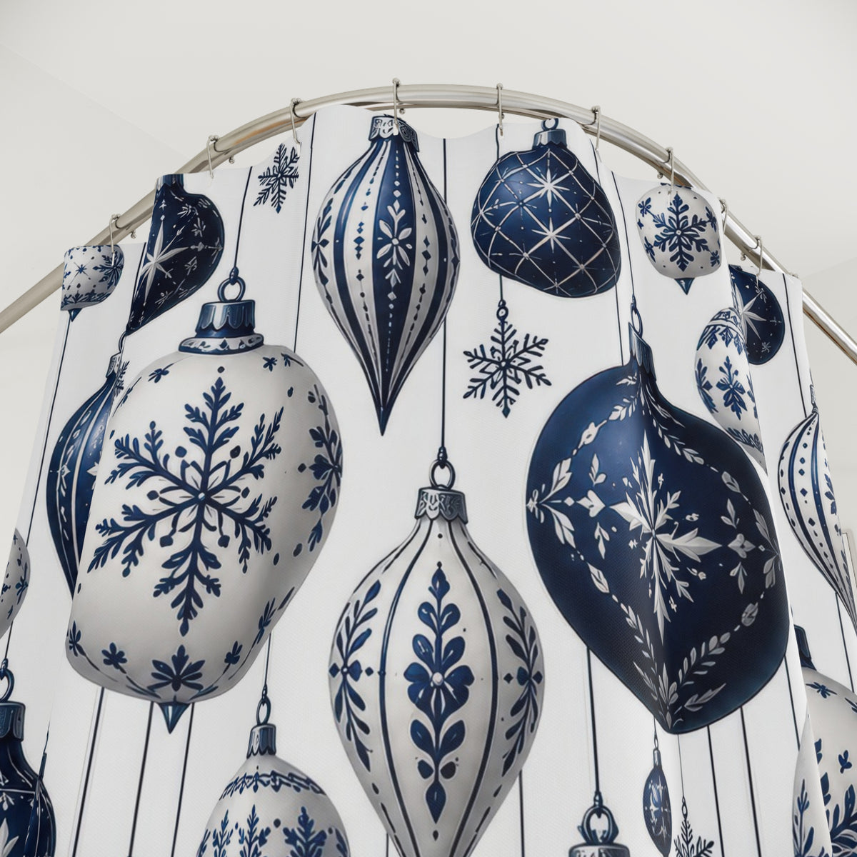 Navy and white hanging baubles with snowflakes and stars shower curtain with close-up print, hooks, and folds