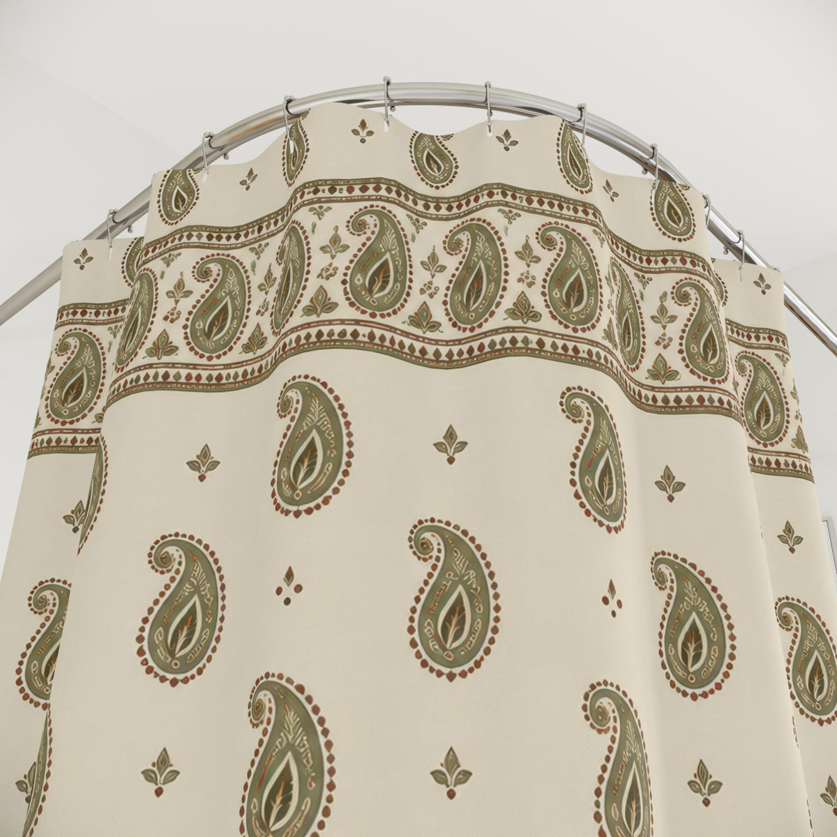Sage paisley borders and rust outlines on cream shower curtain with close-up print, hooks, and folds