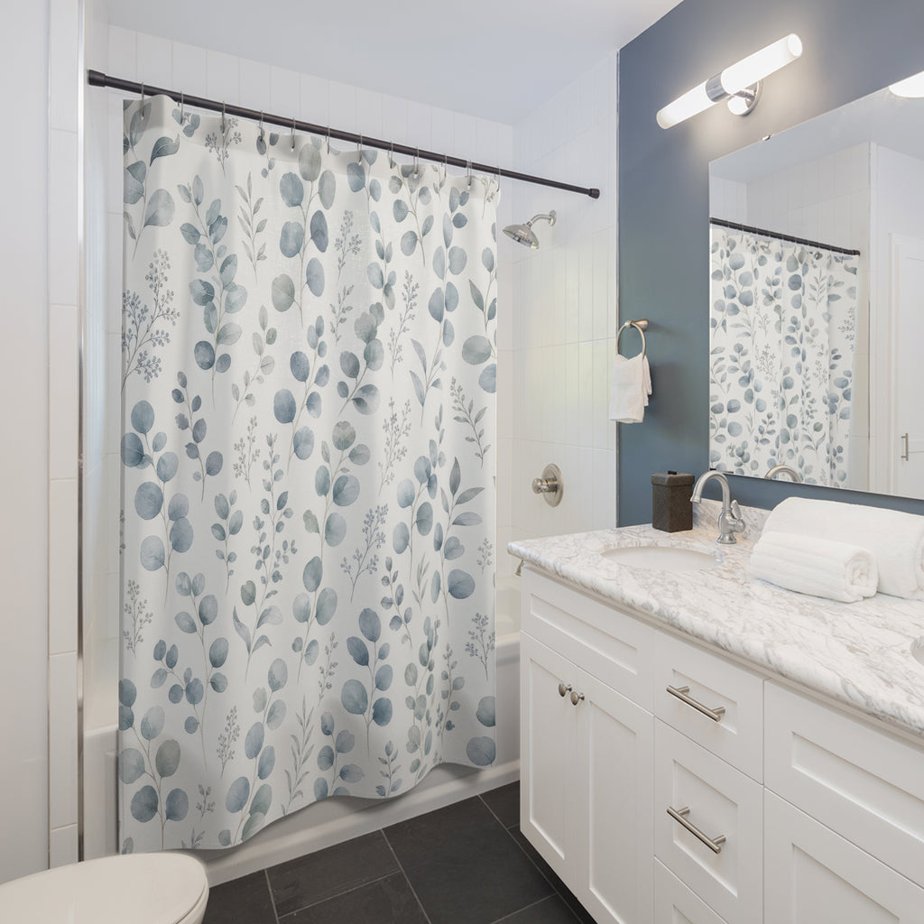 Blue Green Botanical eucalyptus soft shower curtain beside a white vanity