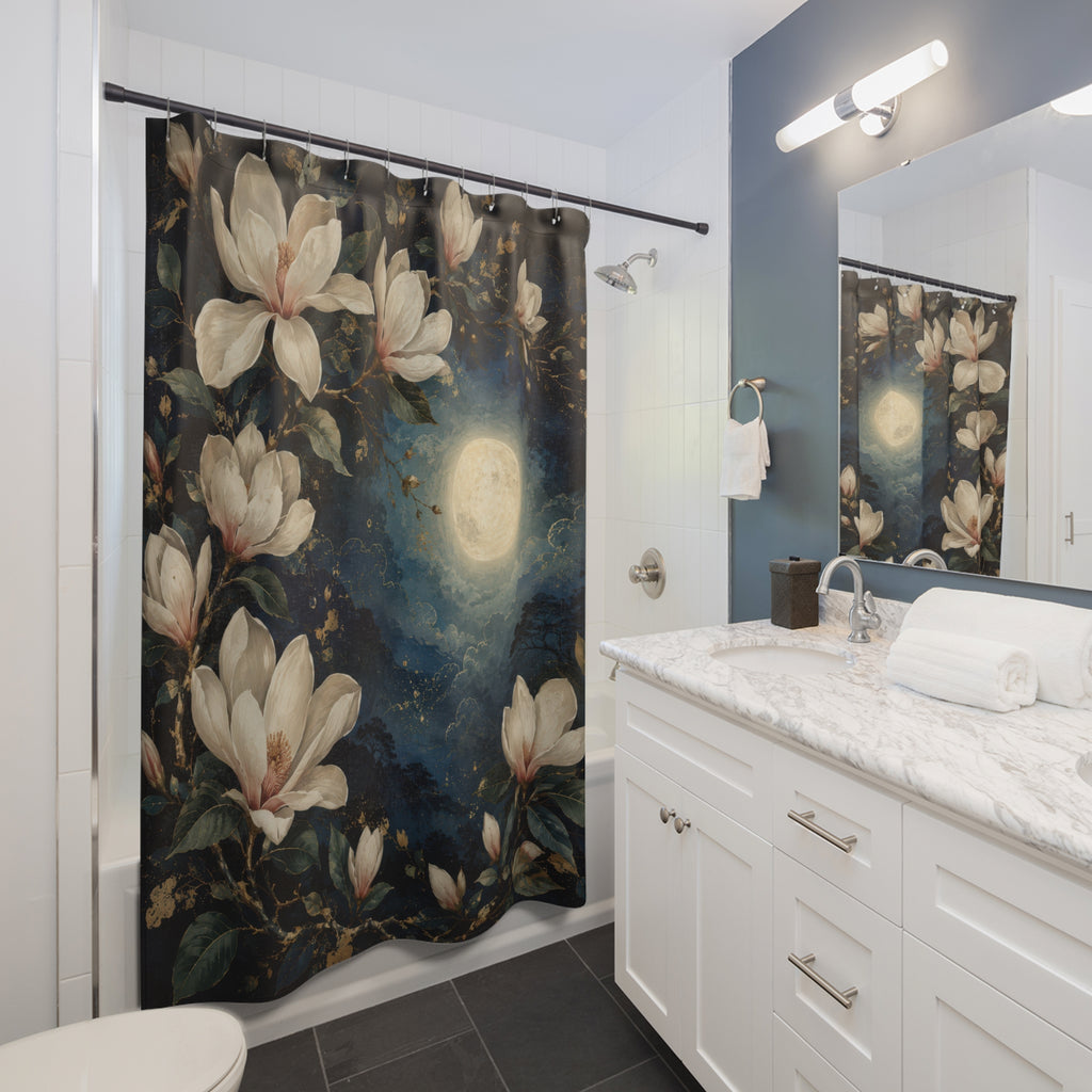 Moonlit ivory magnolia blossoms on midnight blue shower curtain beside a white vanity