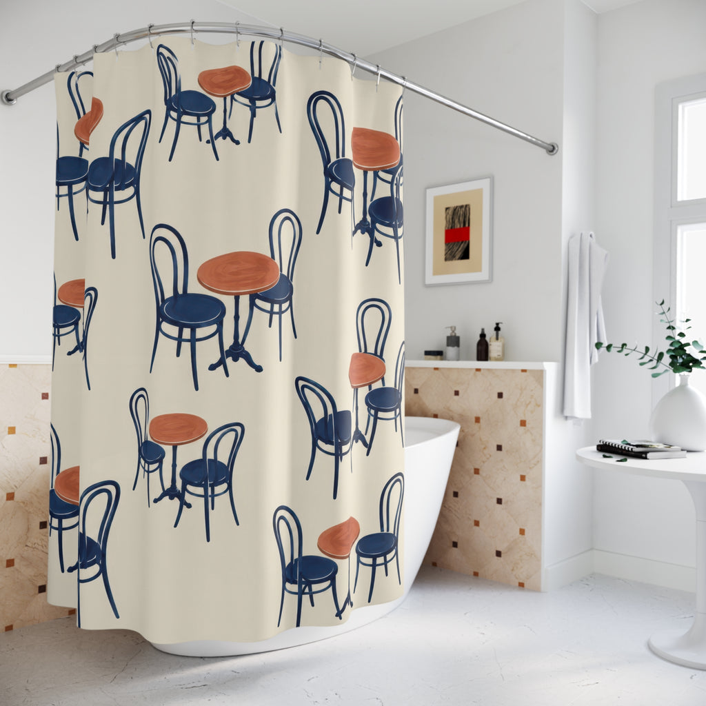 Navy bentwood chairs and terracotta café tables on ivory shower curtain beside a freestanding tub