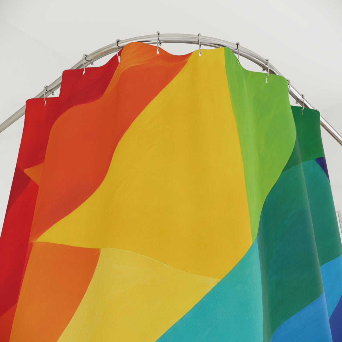 Sweeping rainbow color blocks with deep blue accents shower curtain with close-up print, hooks, and folds