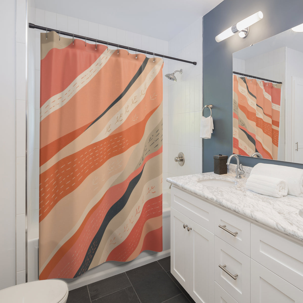 Sweeping coral ribbons with hand-drawn sprig marks shower curtain beside a white vanity