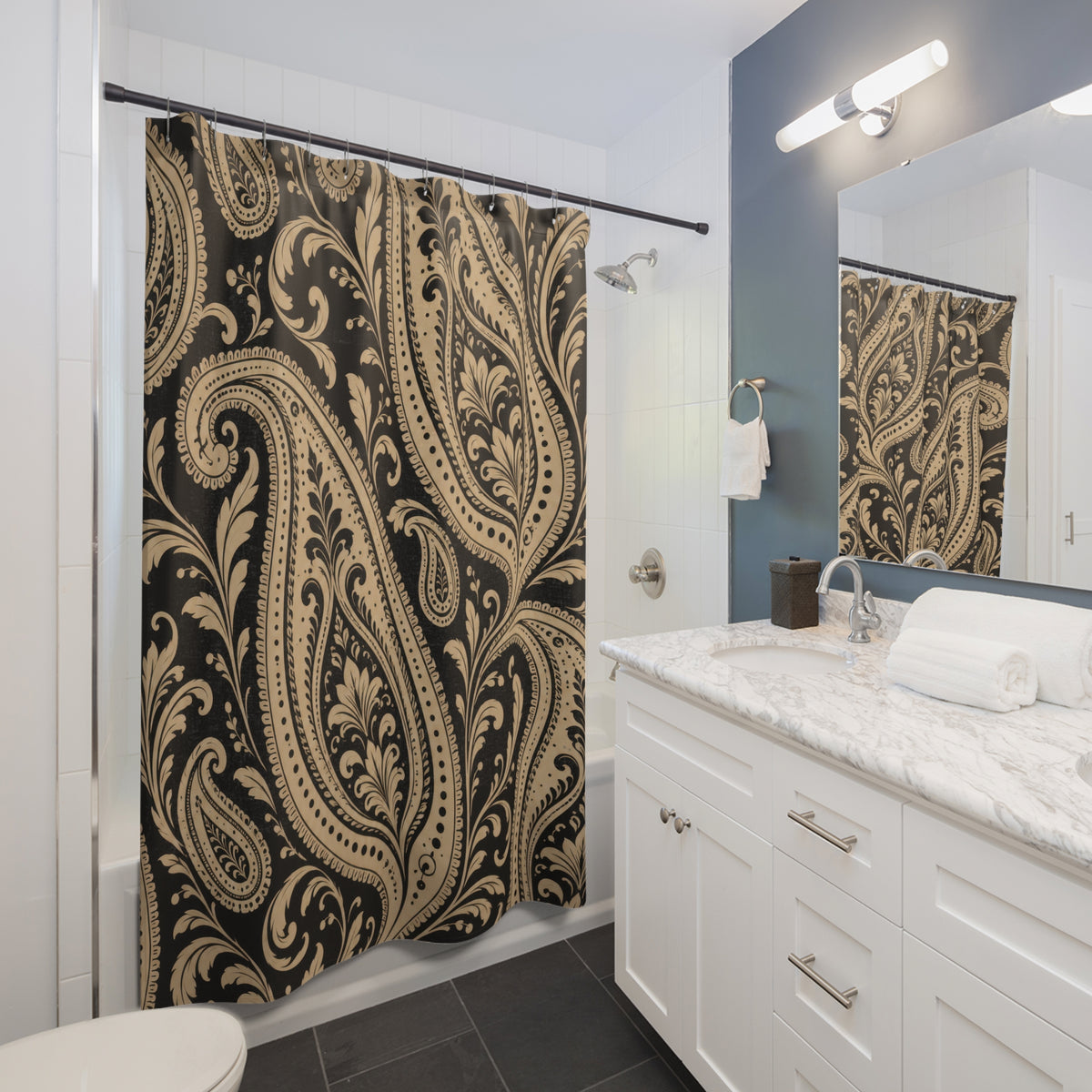Beige and black paisley scrollwork shower curtain beside a white vanity