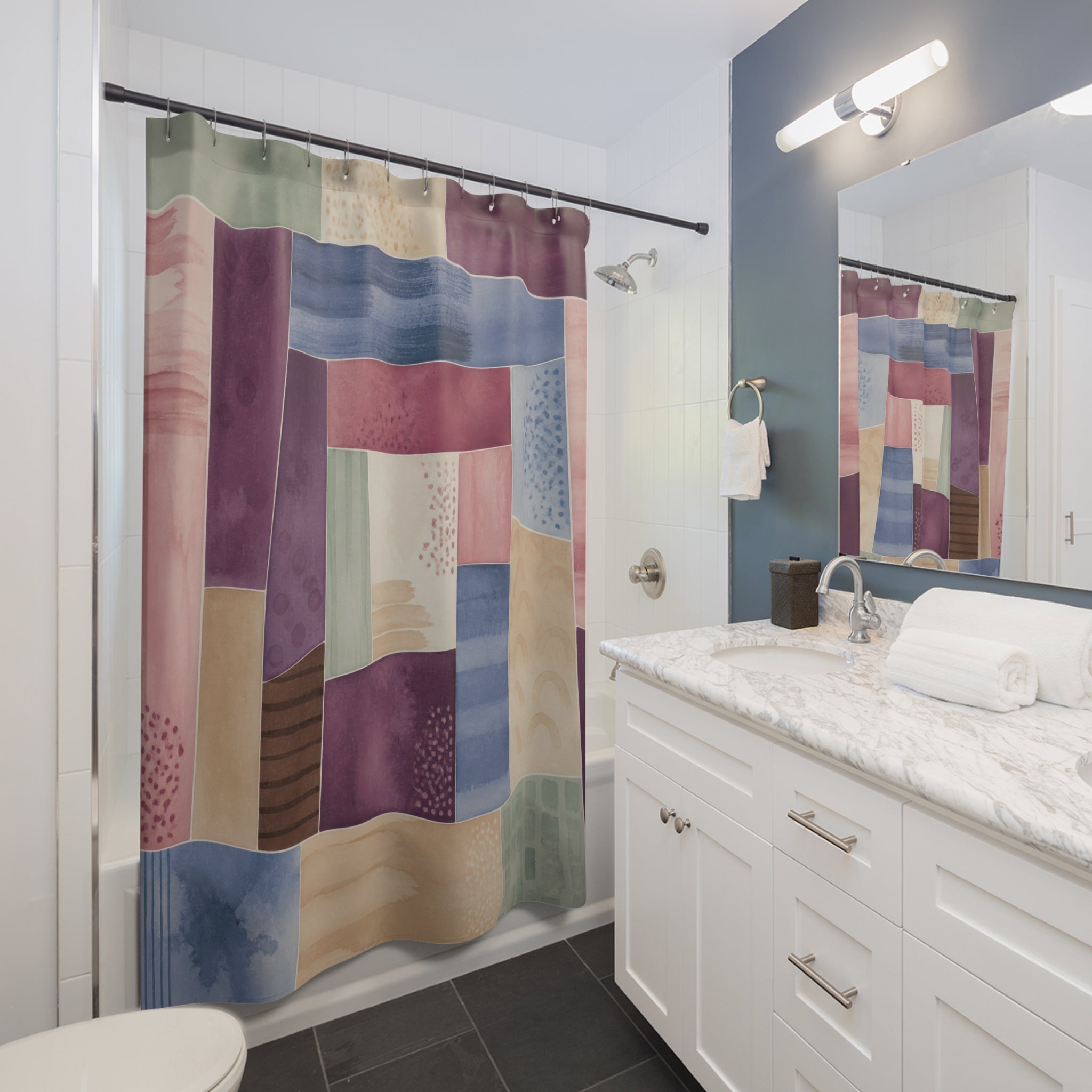 Watercolor patchwork broken frames shower curtain beside a white vanity