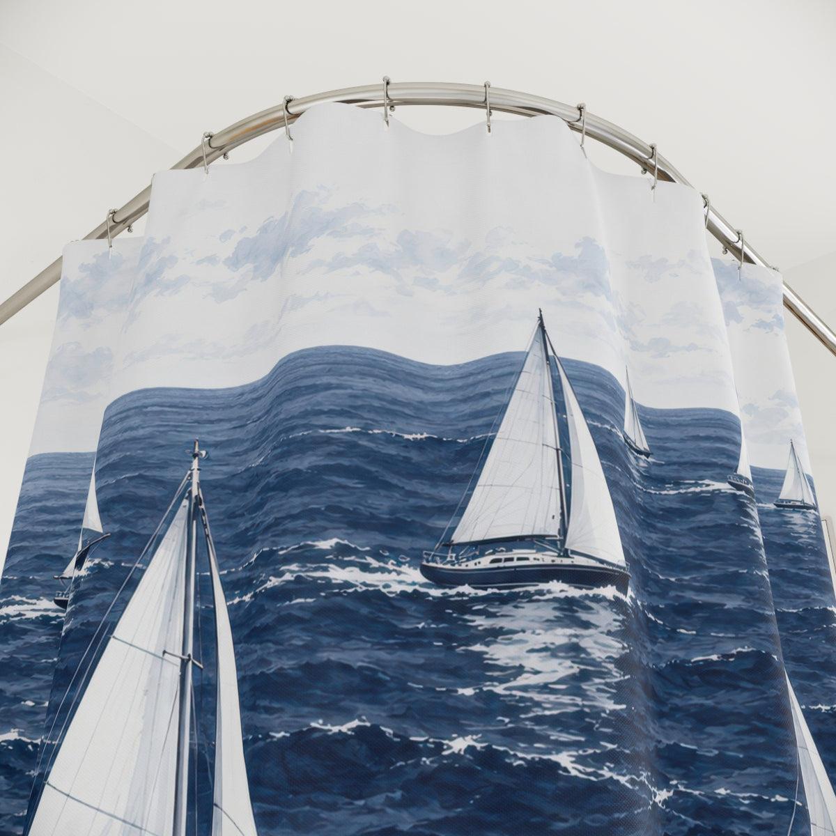 White-sailed yachts crossing a navy sea beneath pale clouds shower curtain with close-up print, hooks, and folds