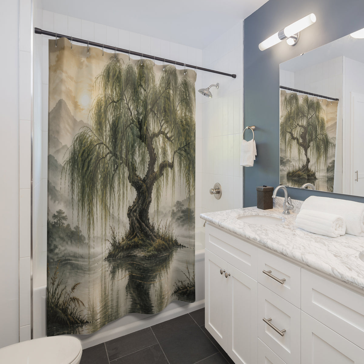 Sage willow tree reflected in a misty mountain lake shower curtain beside a white vanity