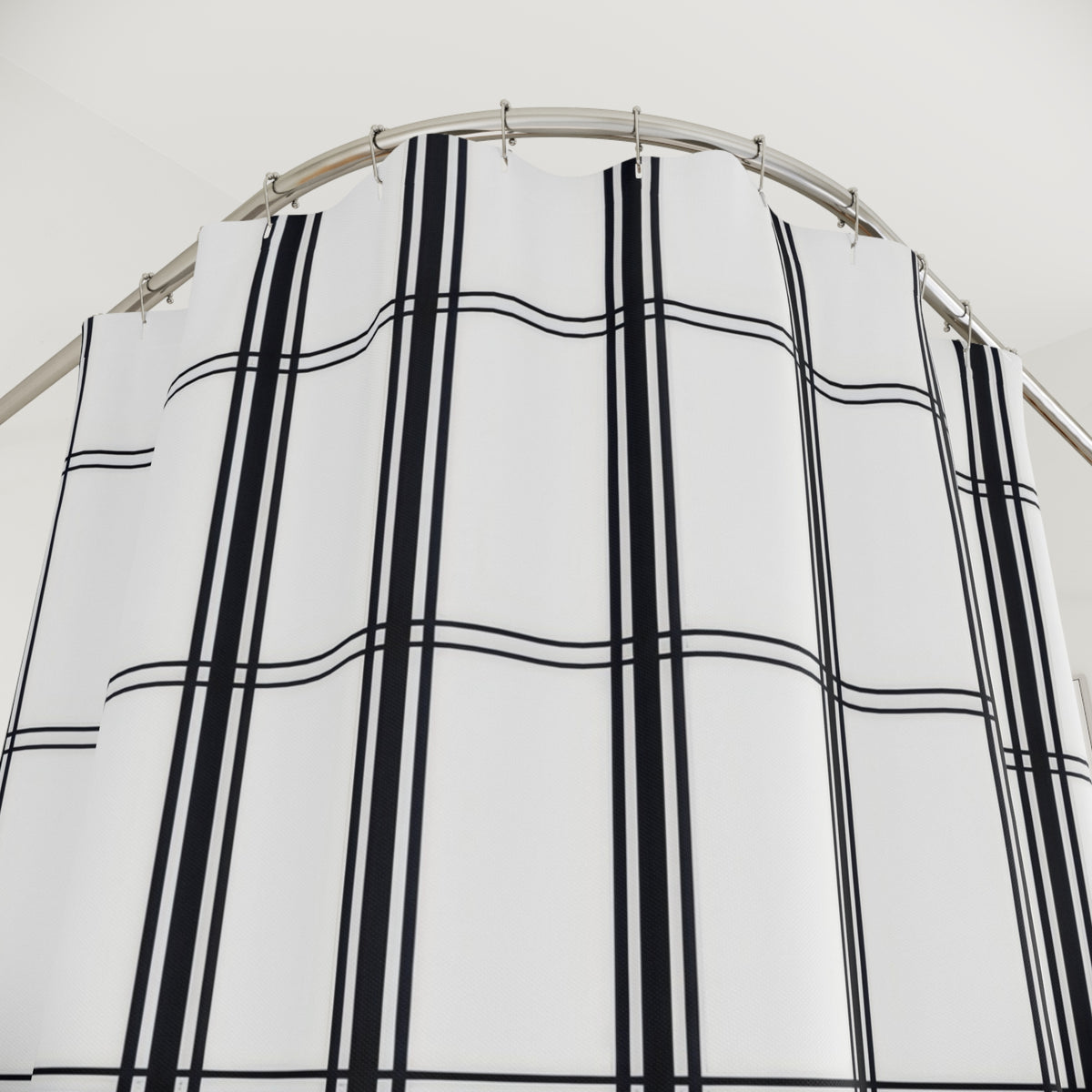 Black vertical stripe groups and fine windowpane crossbars shower curtain with close-up print, hooks, and folds
