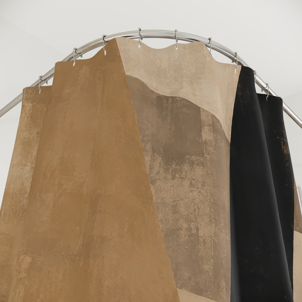 Black and tan angular abstract shower curtain with close-up print, hooks, and folds