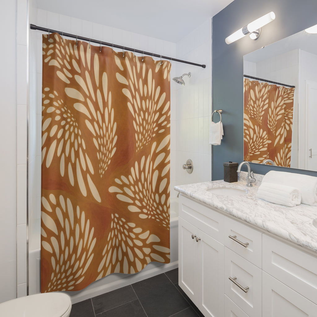 Cream fawn spot fans on ochre and burnt orange shower curtain beside a white vanity