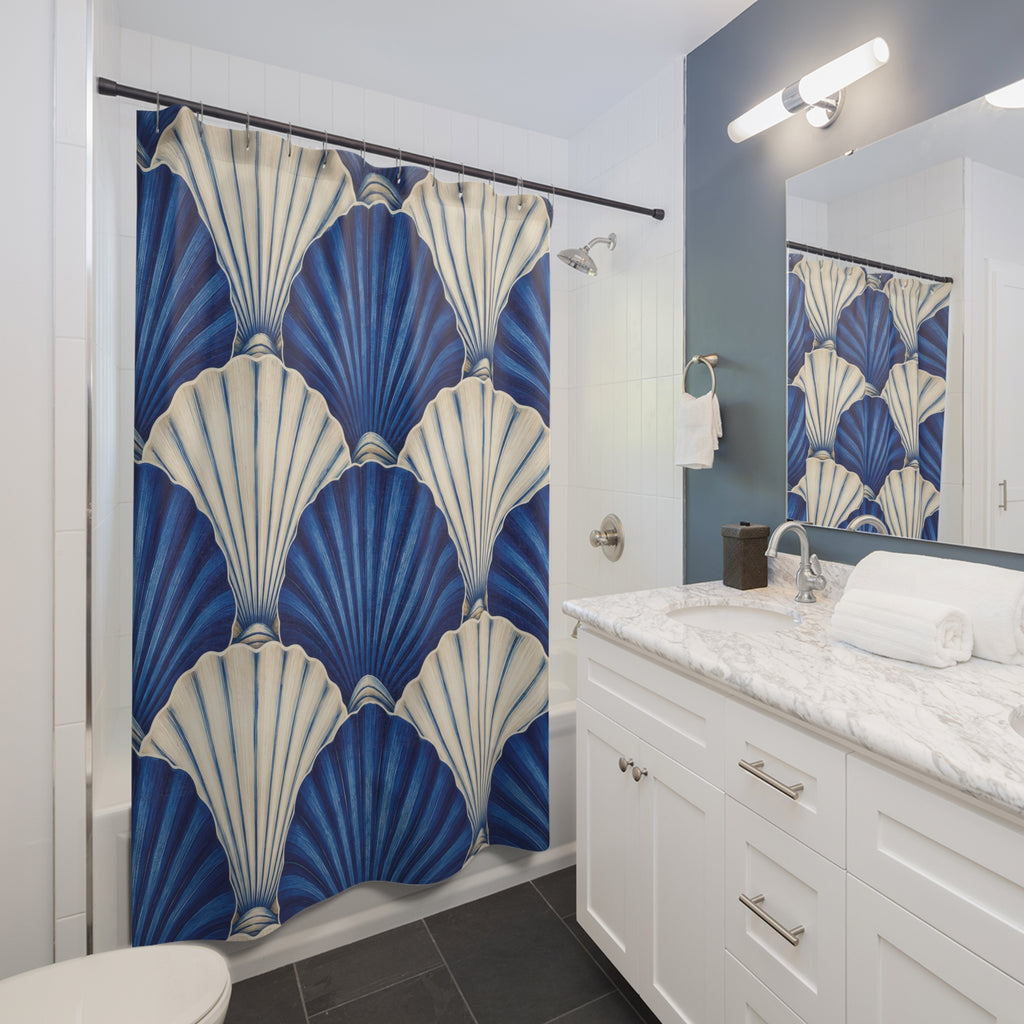 Overlapping cobalt blue and ivory scallop shells shower curtain beside a white vanity