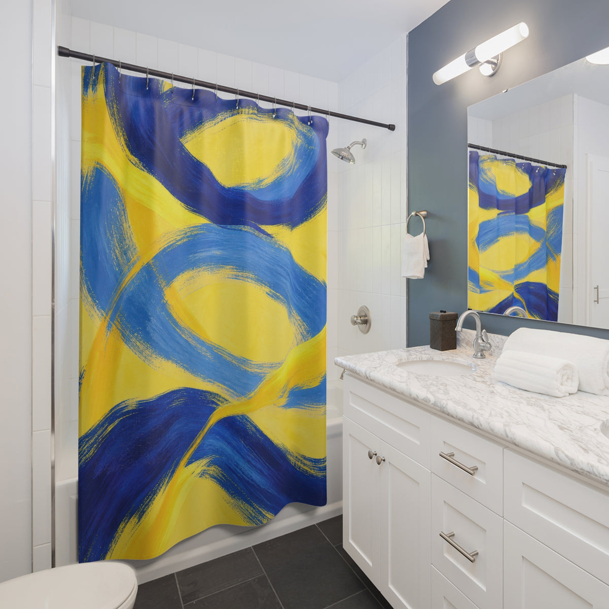 Blue brushstroke loops crossing a sunny yellow ground shower curtain beside a white vanity