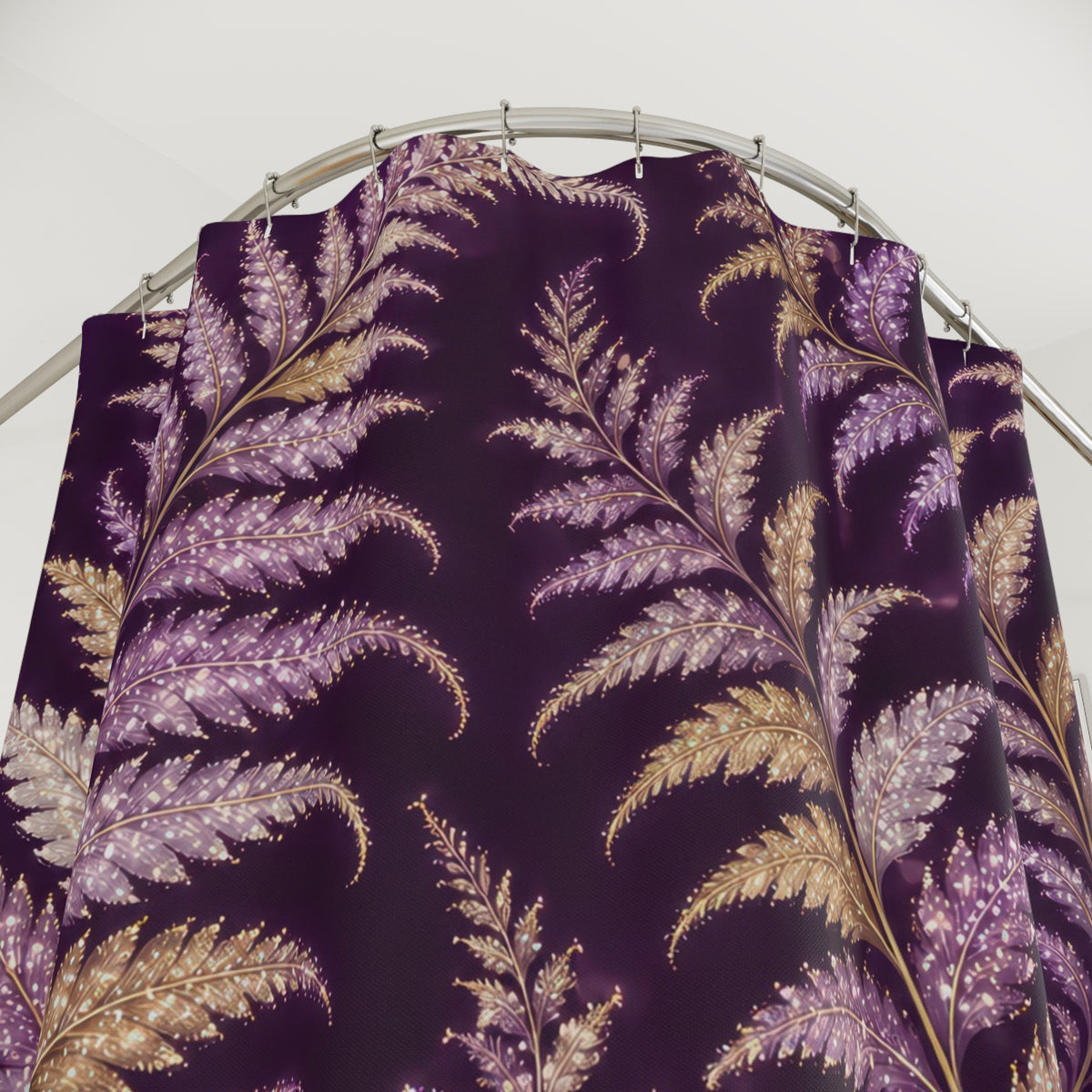Lilac and gold-colored fern fronds on purple shower curtain with close-up print, hooks, and folds