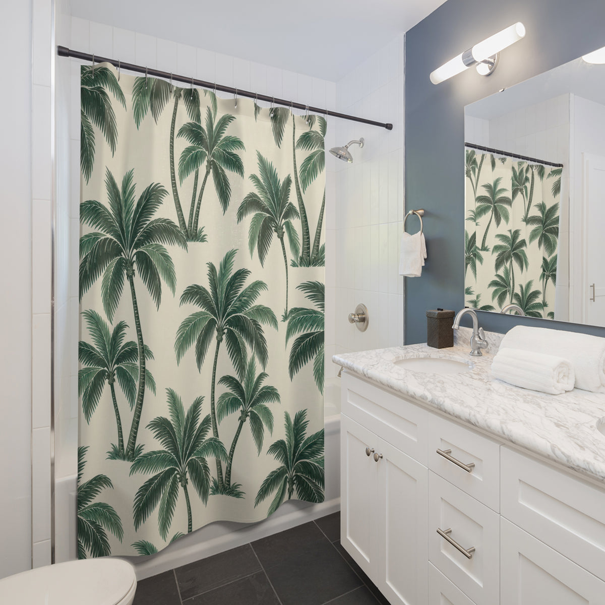 Green palm trees with curved trunks on warm cream shower curtain beside a white vanity