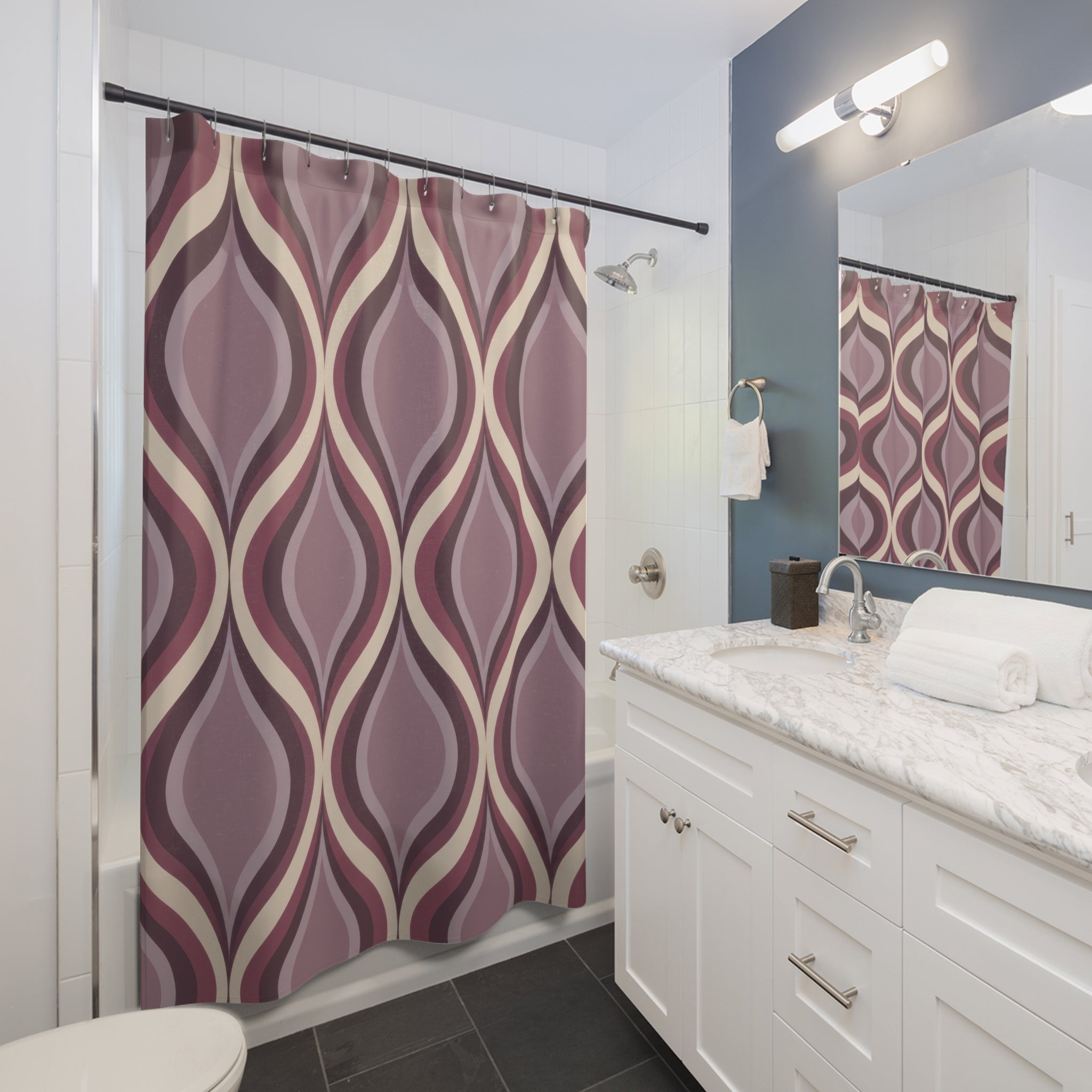 Mauve nested ogee ribbon pattern in plum and lilac shower curtain beside a white vanity