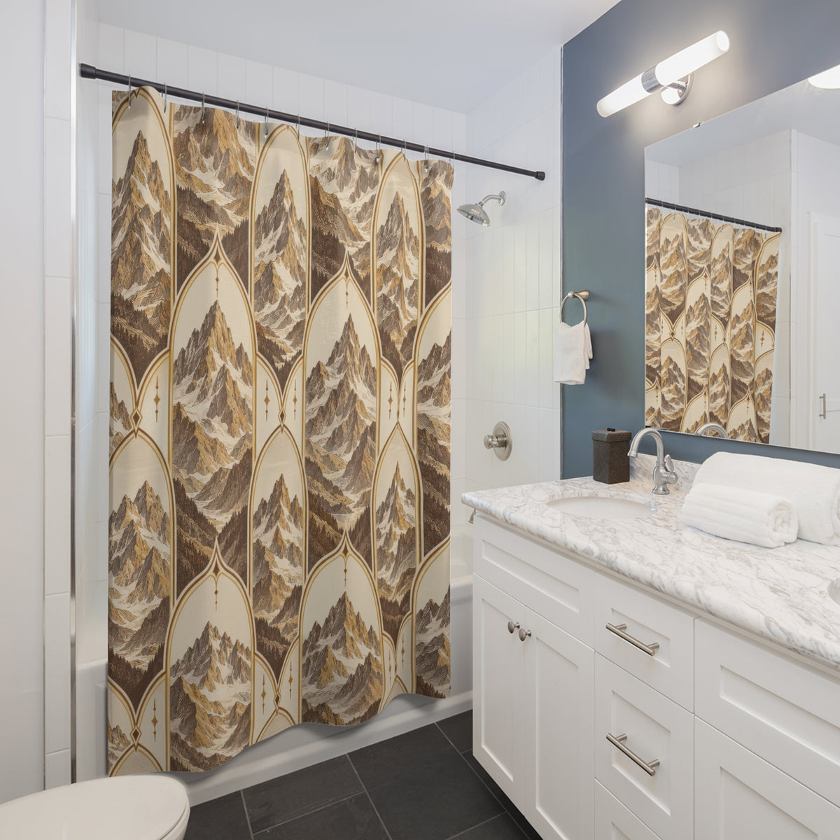 Ochre and brown mountains framed by pointed cream arches shower curtain beside a white vanity