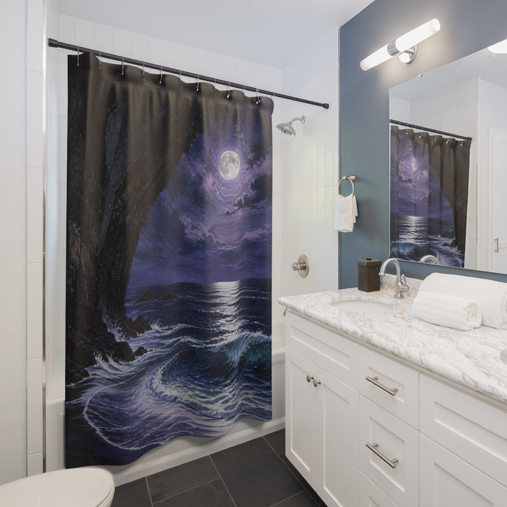 Moonlit ocean cove beneath a dark basalt arch shower curtain beside a white vanity