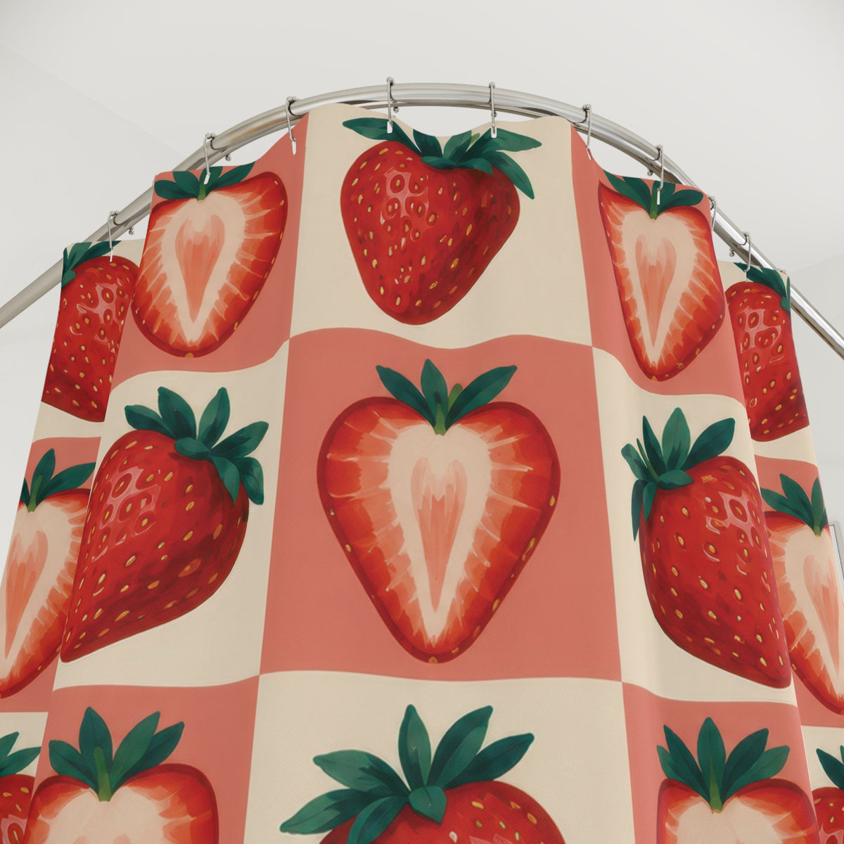 Red strawberries on coral and cream checks shower curtain with close-up print, hooks, and folds