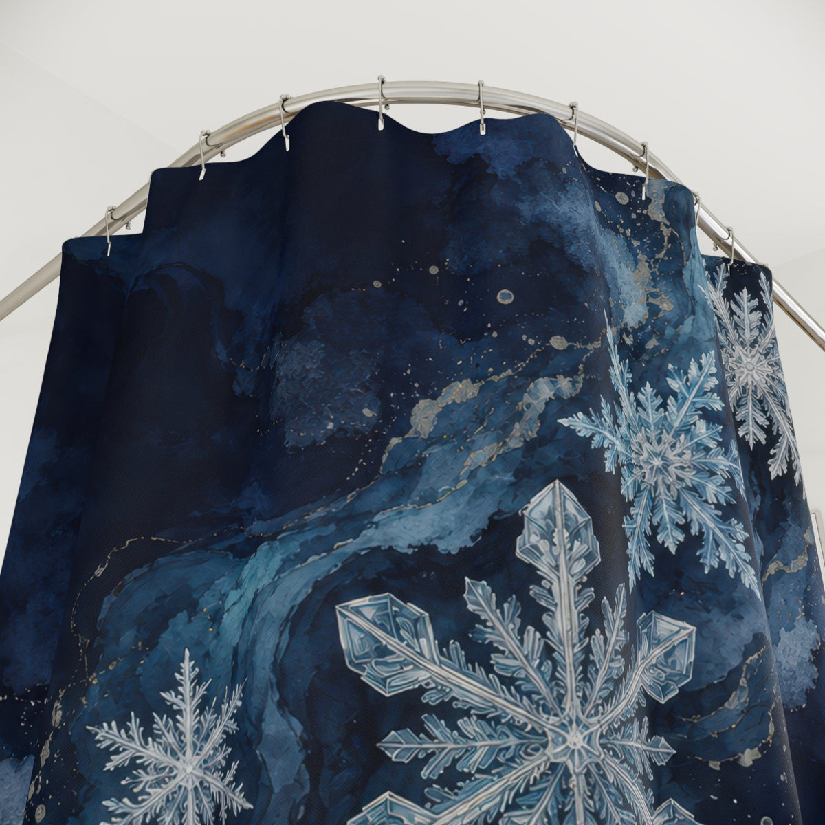Midnight blue snowflake cascade shower curtain with close-up print, hooks, and folds