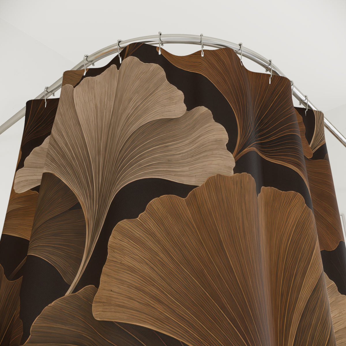 Brown and taupe ginkgo fans on an espresso background shower curtain with close-up print, hooks, and folds
