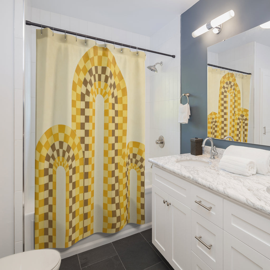 Mustard yellow checker arches on cream shower curtain beside a white vanity