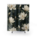 Creamy-white magnolias and olive leaves on dark green shower curtain with full front view