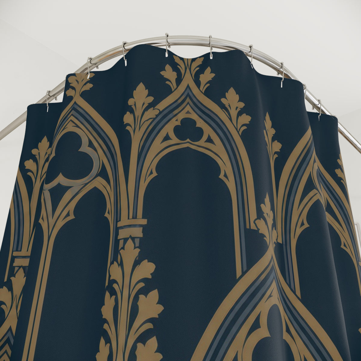 Ochre pointed arches and trefoil tracery on dark navy shower curtain with close-up print, hooks, and folds