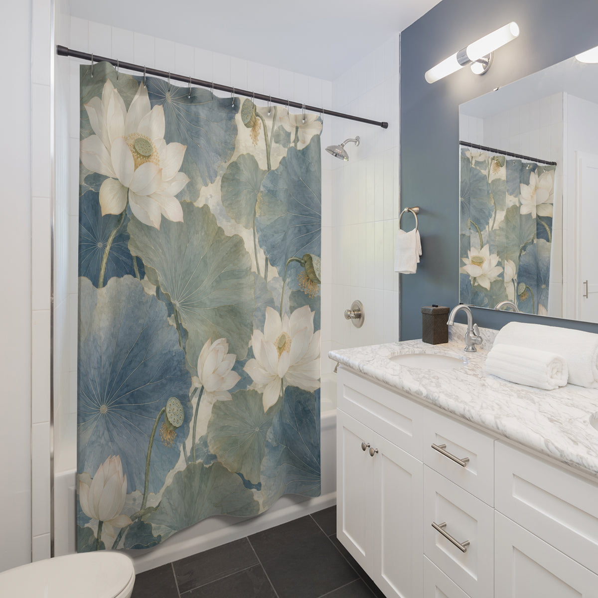 White lotus with blue and sage Chinoiserie leaves shower curtain beside a white vanity