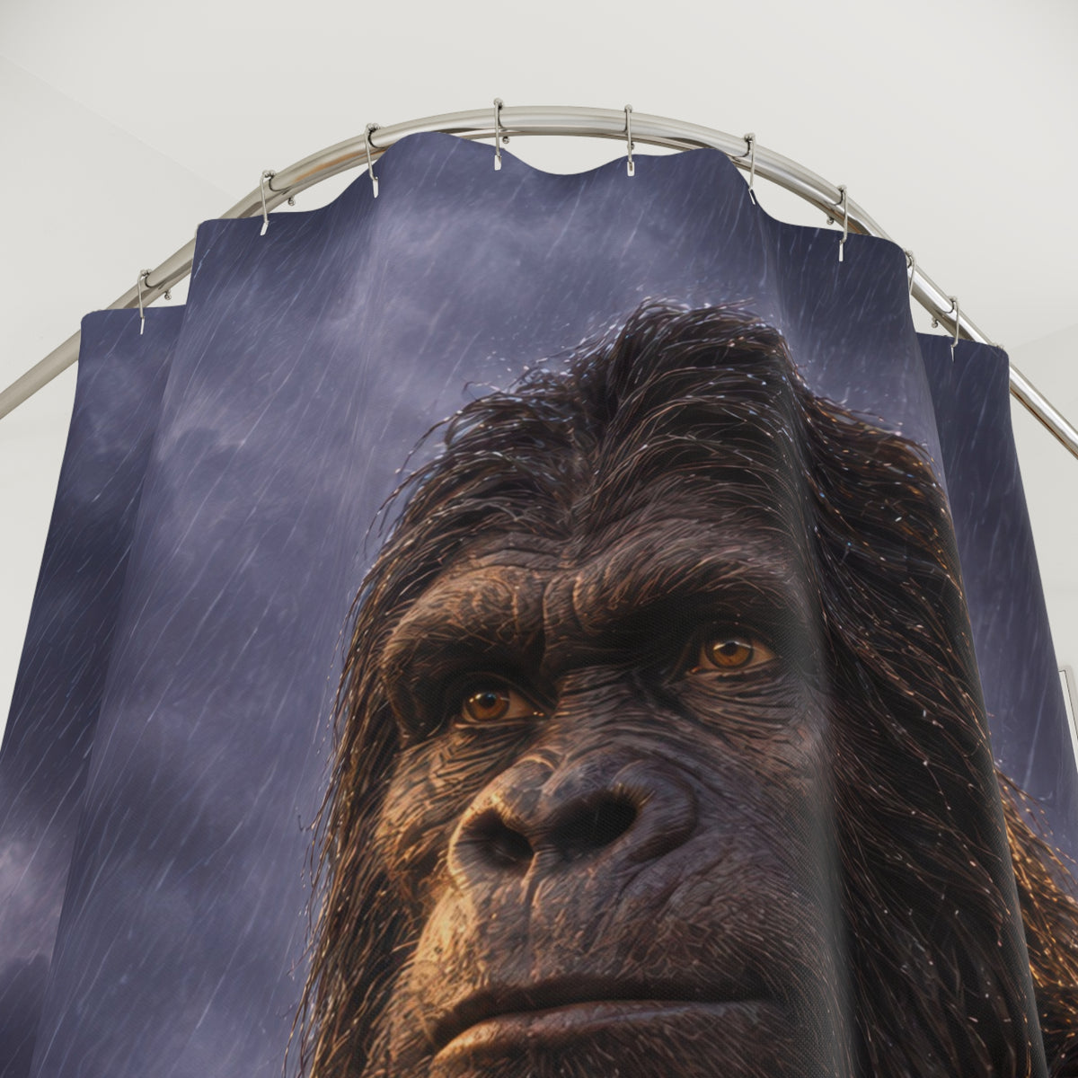 Dark brown Bigfoot portrait against slate-violet rain shower curtain with close-up print, hooks, and folds