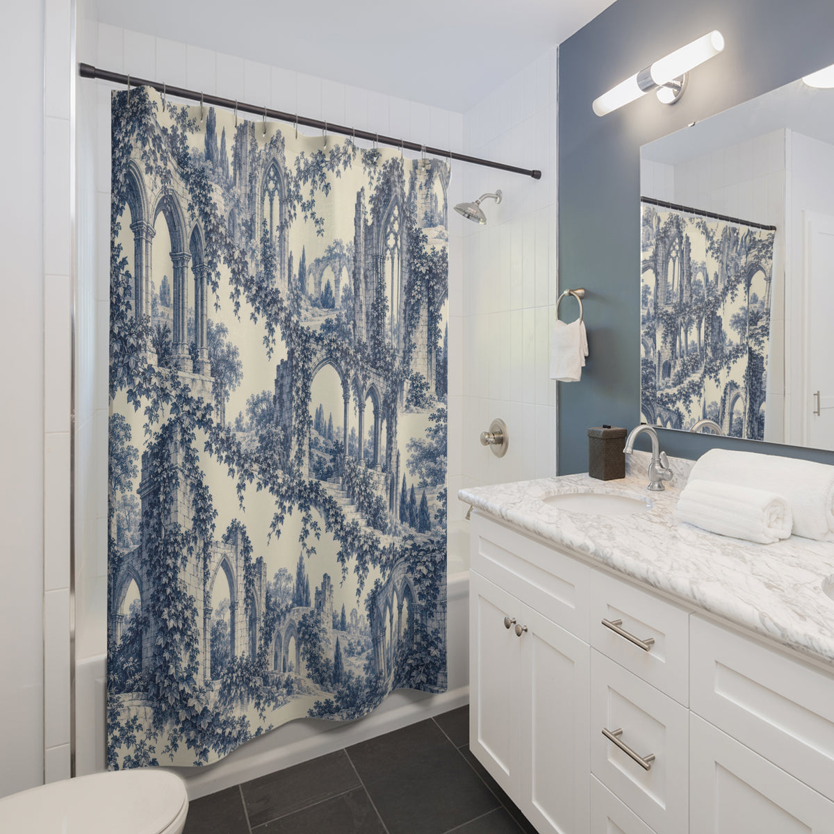 Blue Gothic abbey arches and trailing ivy on ivory shower curtain beside a white vanity