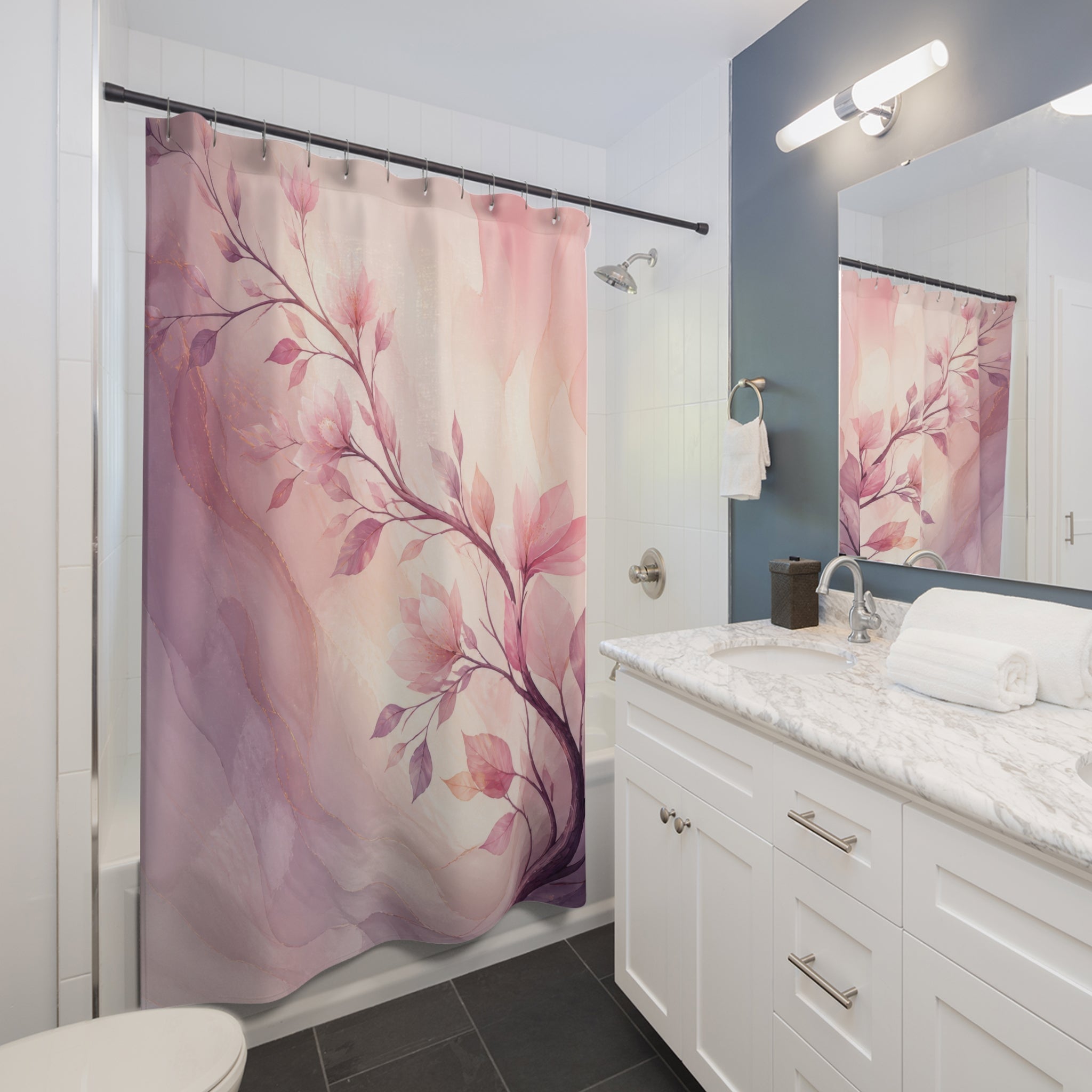 Blush and lilac watercolor branch sweeping across an airy field shower curtain beside a white vanity