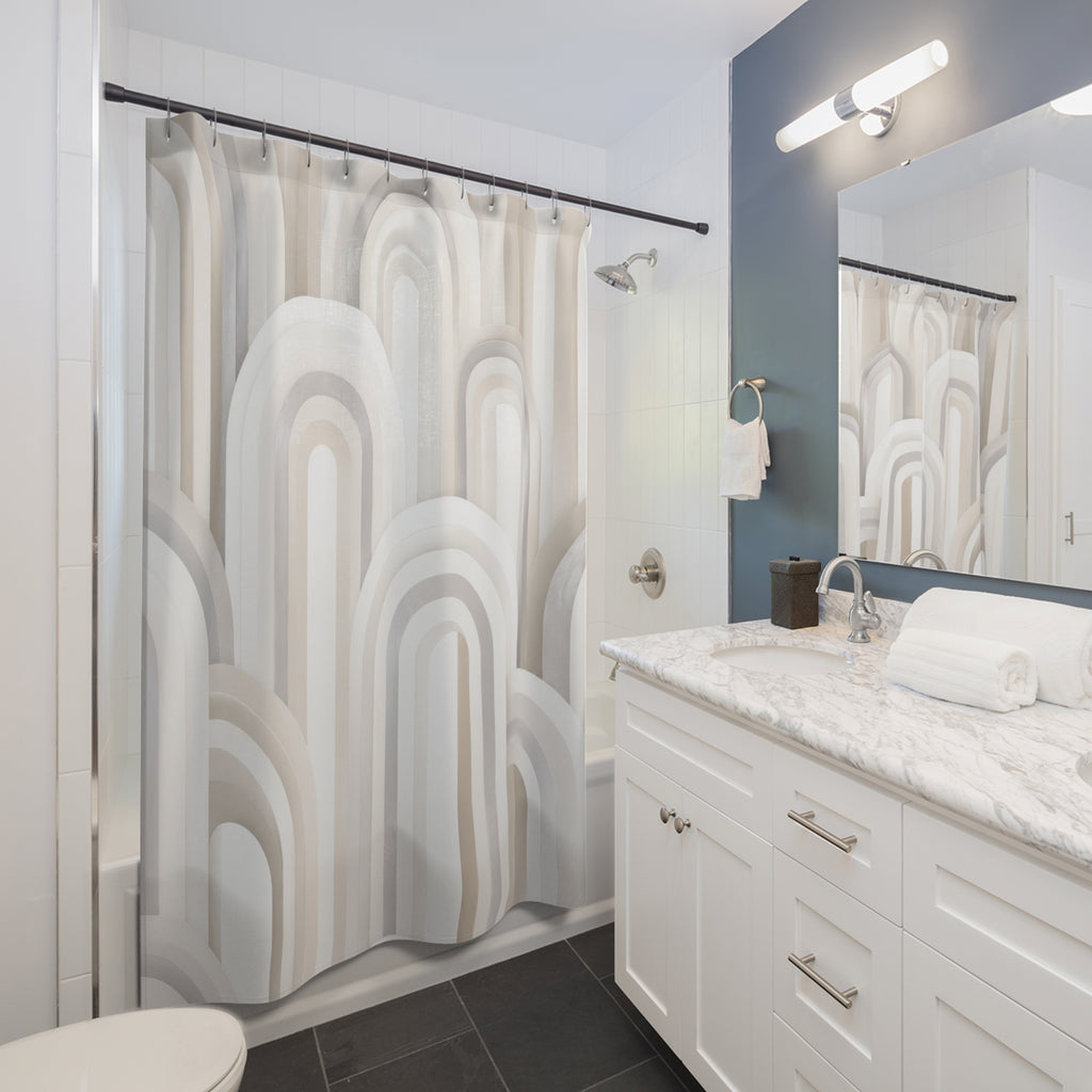 Layered white and ivory nested arches with pearl-gray edges shower curtain beside a white vanity