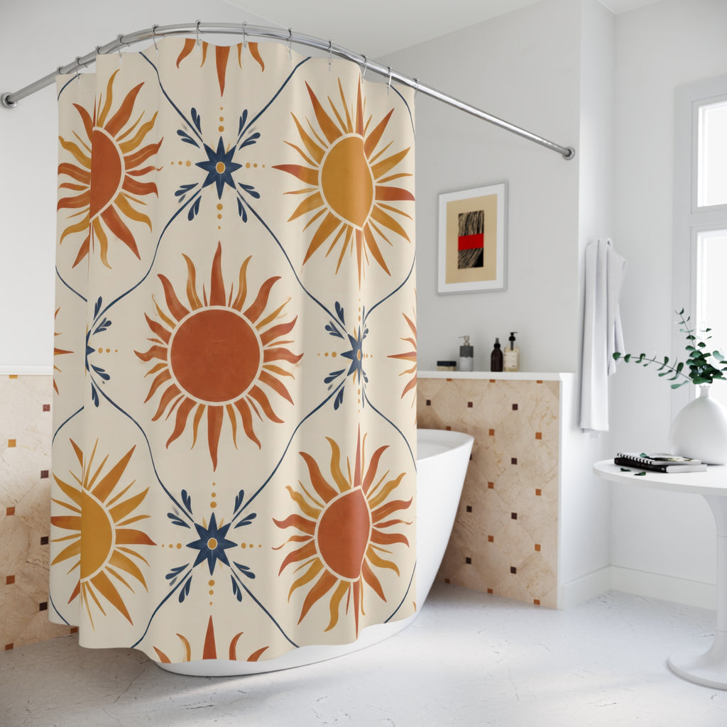 Terracotta and ochre suns with indigo stars on cream shower curtain beside a freestanding tub