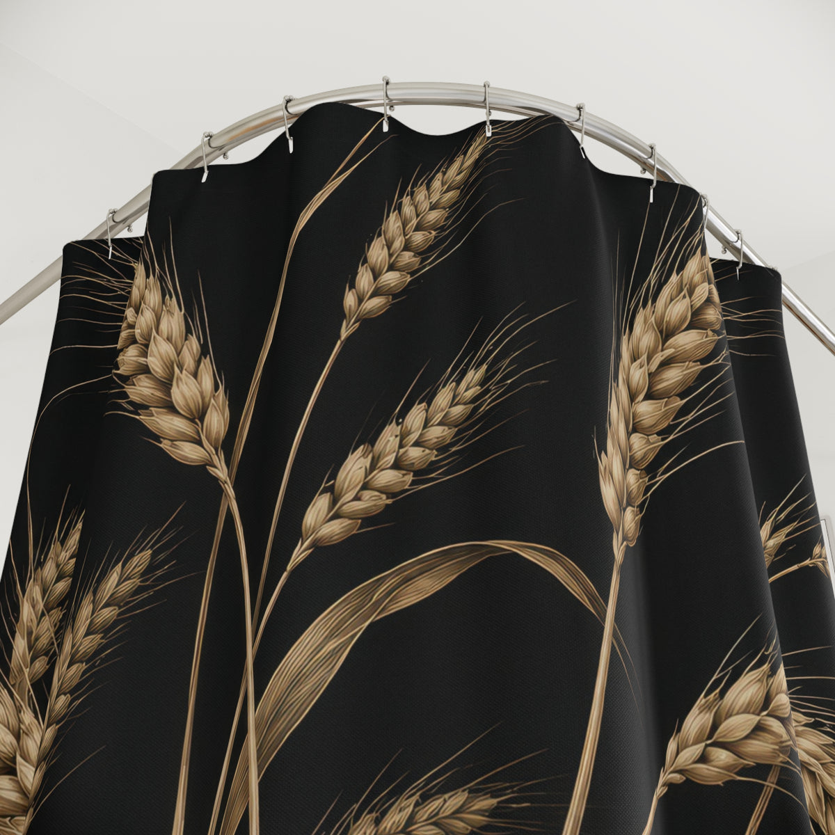 Tan wheat stalks and leaves on black shower curtain with close-up print, hooks, and folds