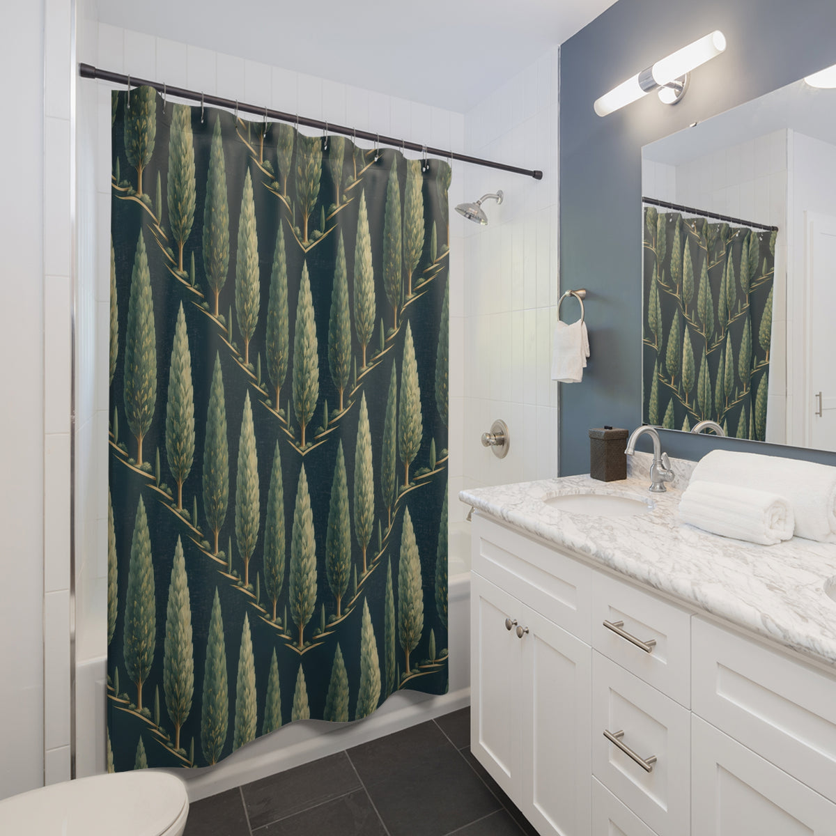 Sage cypress tree chevrons on deep teal shower curtain beside a white vanity