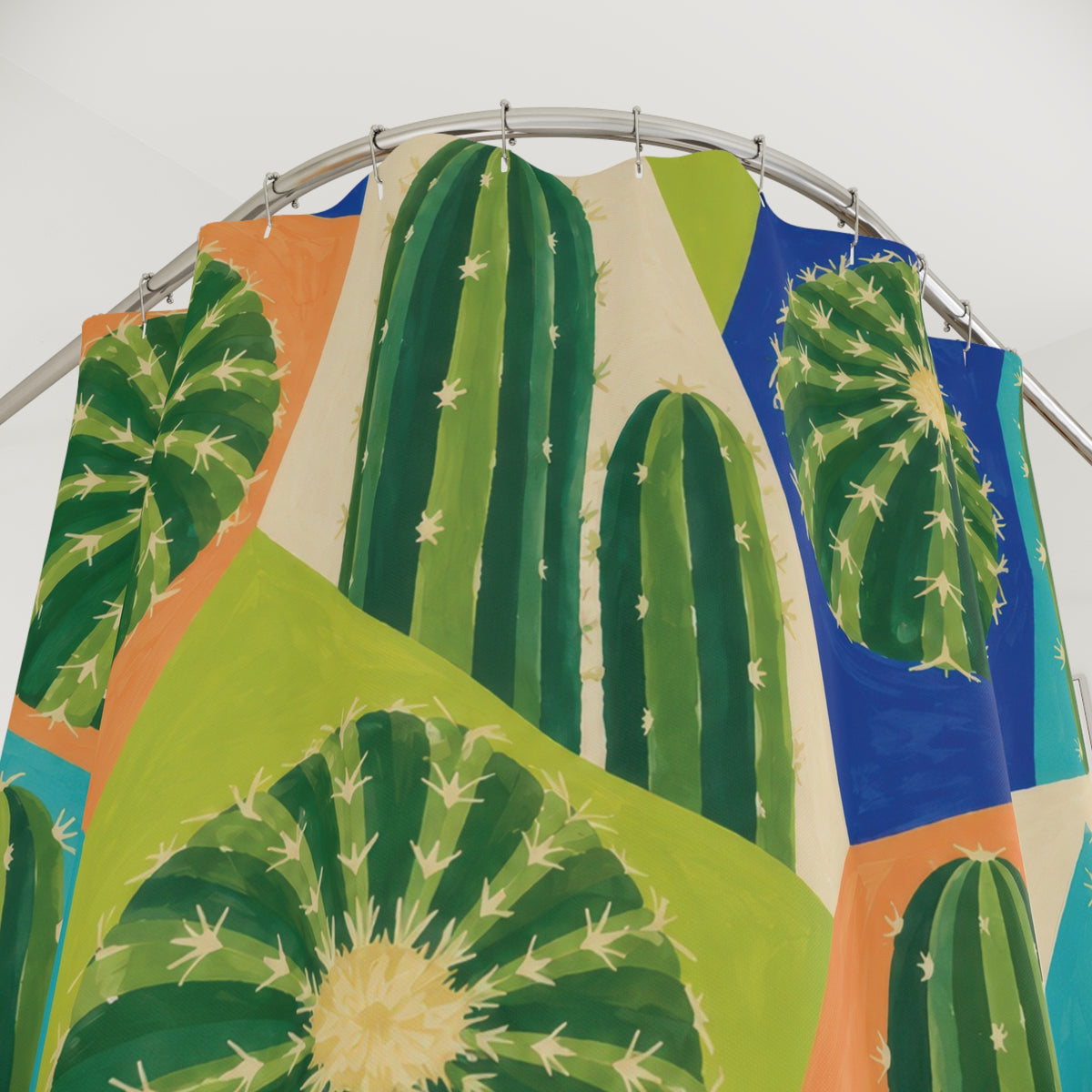 Green barrel and column cactus in colorful geometric panels shower curtain with close-up print, hooks, and folds