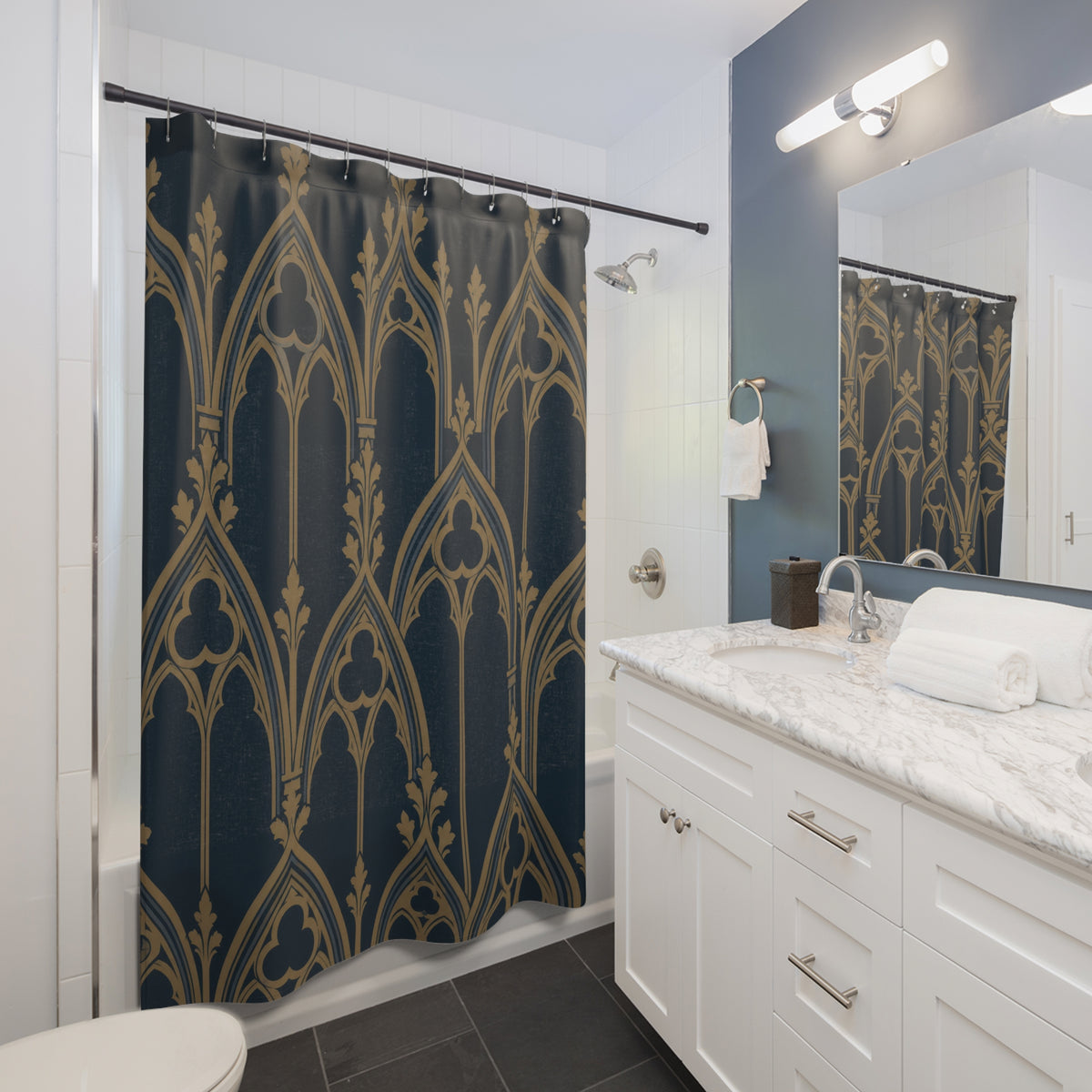 Ochre pointed arches and trefoil tracery on dark navy shower curtain beside a white vanity
