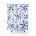 Blue and lilac watercolor snowflakes on white shower curtain with full front view