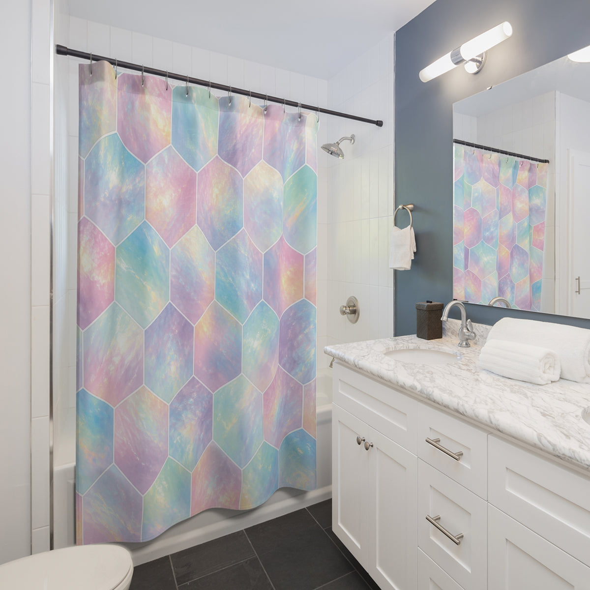 Pastel opal-effect hexagons with fine white outlines shower curtain beside a white vanity