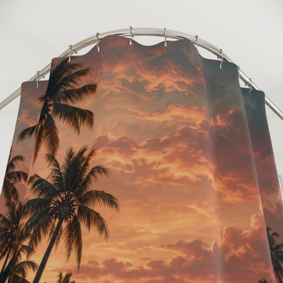 Dark palm trees reflected in teal water under a copper sunset shower curtain with close-up print, hooks, and folds