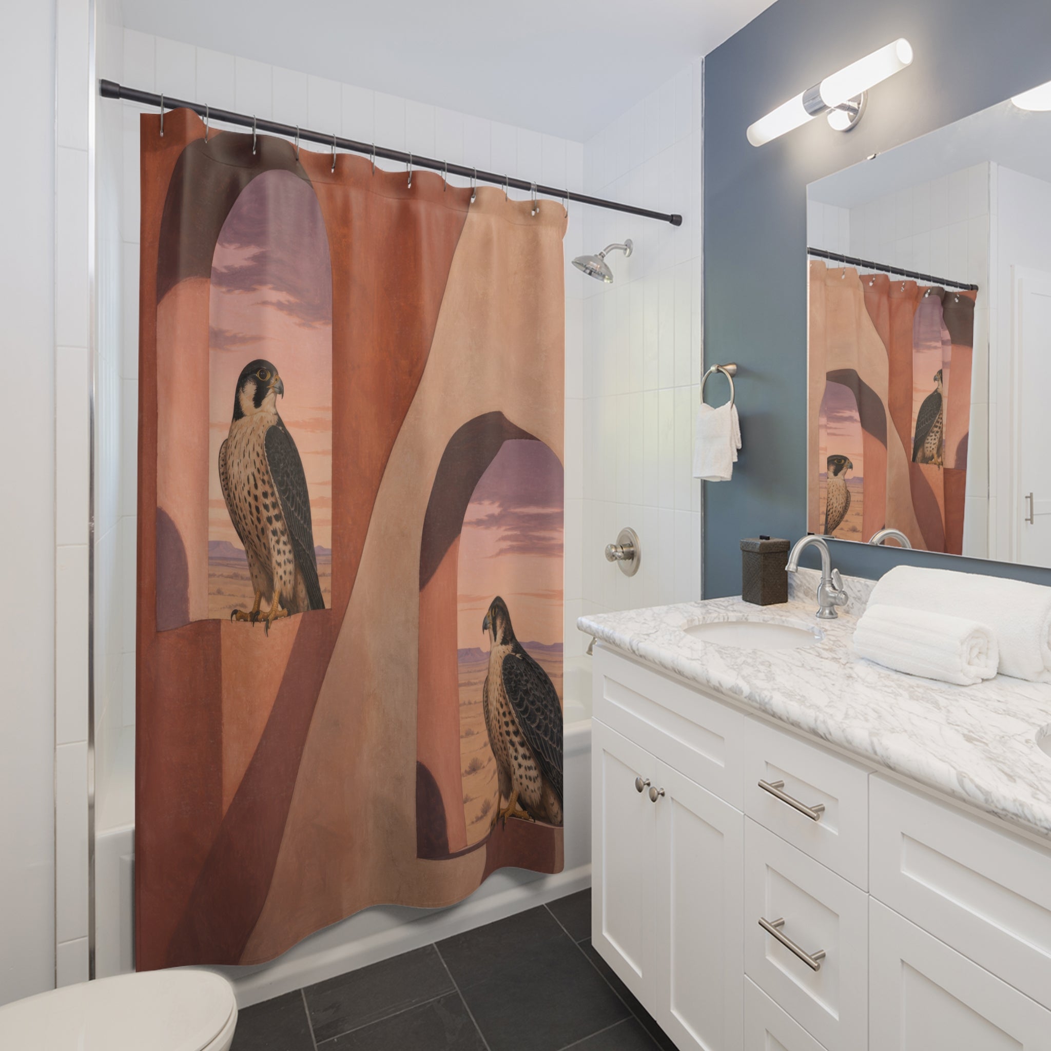 Two falcons perched inside terracotta desert adobe arches shower curtain installed beside a white vanity