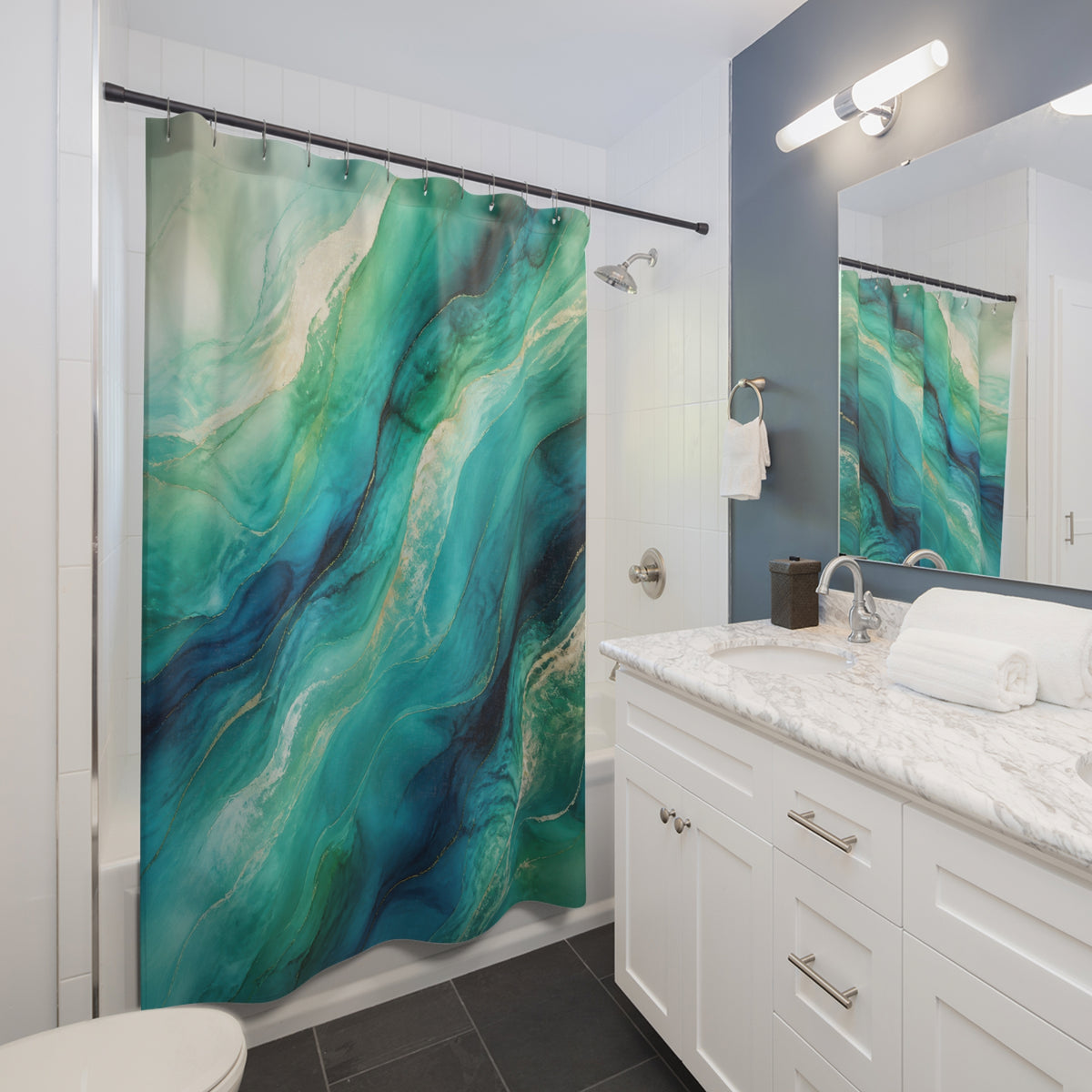 Sweeping turquoise and peacock blue abstract tidal veils shower curtain beside a white vanity