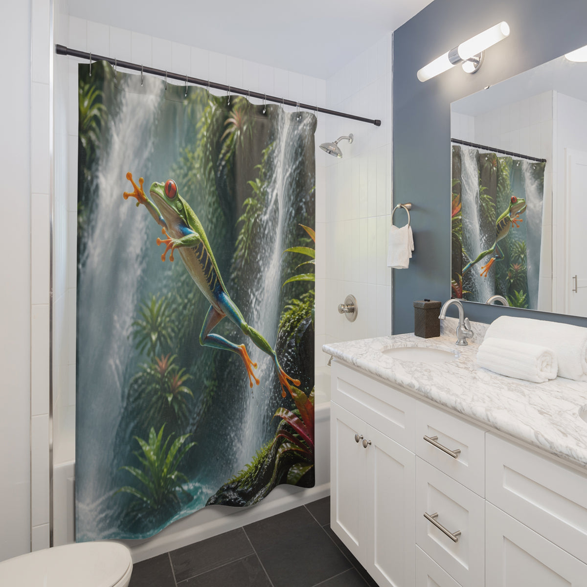 Green tree frog leaping across a jungle waterfall shower curtain beside a white vanity