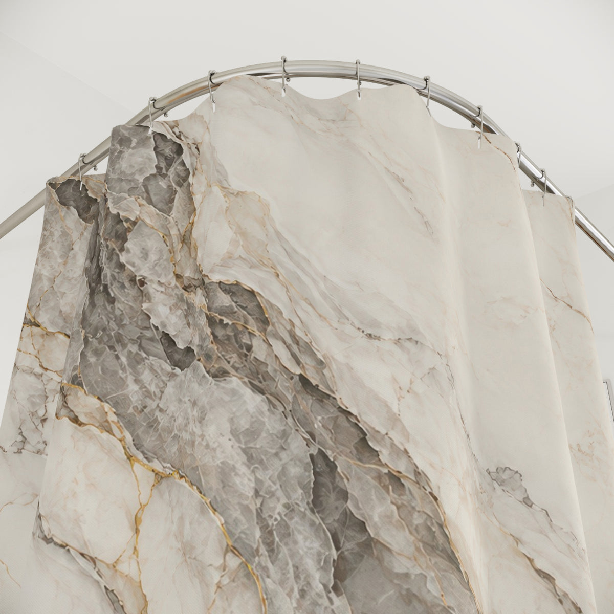 Gray and gold-tone marble veins across warm ivory shower curtain with close-up print, hooks, and folds