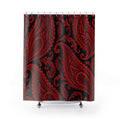 Red paisley teardrops and curling scrollwork on black shower curtain with full front view