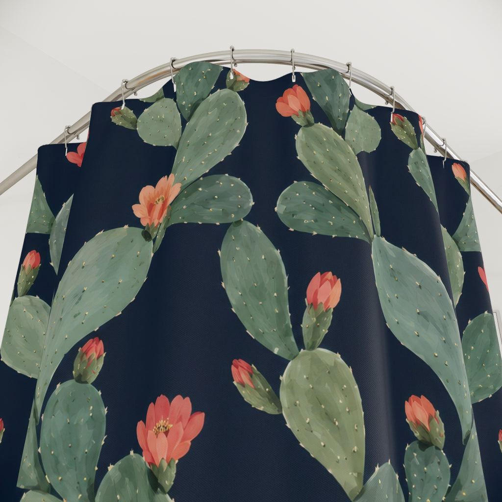 Sage prickly pear cactus with coral flowers on navy shower curtain with close-up print, hooks, and folds